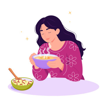 Woman eating from a bowl calmly with food nearby.
