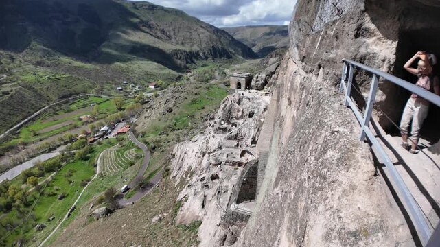 Vardzia cave monastery, a historical complex, carving into Erusheti Mountain in Georgia during the Middle Ages, offering panoramic views of the scenic valley and surrounding landscape