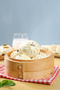 Traditional Chinese Steamed Beef Buns in Bamboo Steamer Basket for Breakfast Dim Sum