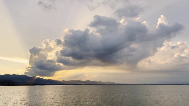 Dramatic Clouds Over Lake at Sunset