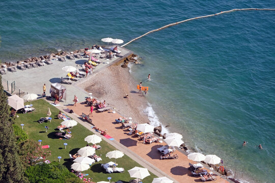 Tourists enjoy the beach in Portoroz, Slovenia