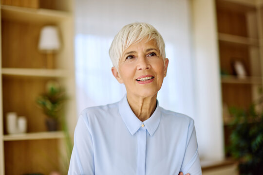Portrait of an active senior elderly businesswoman during a meeting in the office