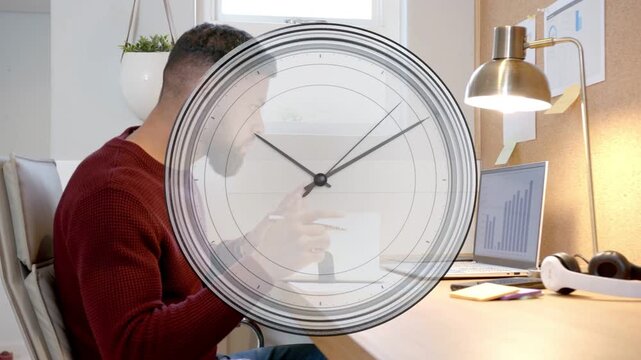 Man at desk tapping tablet, writing and sipping while analog clock overlay tracking business chart