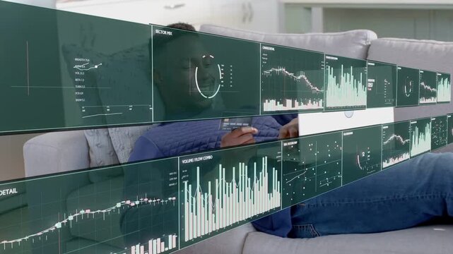 Man reclining on sofa tapping tablet causing tech dashboards animating in front of him and updating