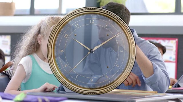 Teacher addressing class, clock marking time, students raising hands, using tablet, observing lab