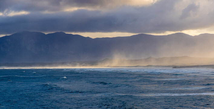 magnificent coastline and waves in early morning light, DeKelders, South Africa