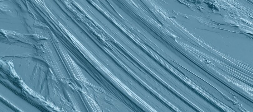 Cycling tire track curves on pale textured surface with diagonal composition