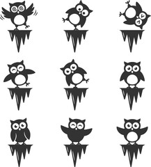 Obraz premium Set of black owl silhouettes balancing on ice peaks