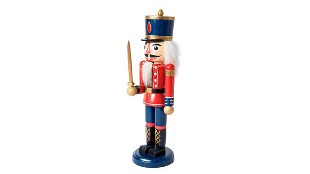 Traditional festive wooden Christmas nutcracker soldier figurine isolated on transparent background cut out