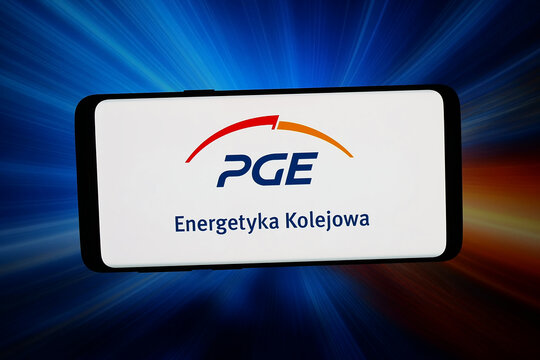 Stuttgart, Germany - 06-22-2026: In this photo illustration, the logo of company PGE Polska Grupa Energetyczna S.A. is displayed on a smartphone in front of abstract background on computer screen.