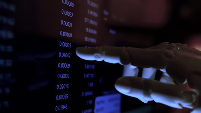 AI humanoid robot arm reading financial charts on a monitor. Premium low-key close-up shot of artificial intelligence in business.