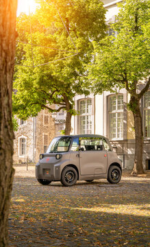New 2026 Citroen Ami electric microcar parked in a small french town