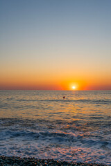 Obraz premium Beautiful sunset over the sea with wave. Evening sea landscape