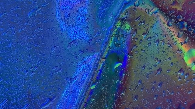 Iridescent water droplets abstract pattern