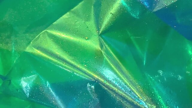 Green crumpled foil texture