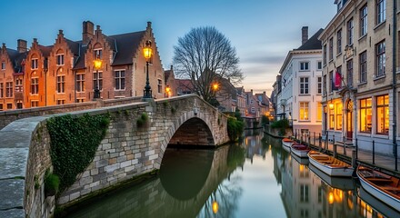 Obraz premium Scenic Evening View of Historic Bridge and Riverside Buildings in a European City.