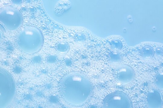 Soft blue foam bubbles float gently. Clear spheres glisten with light reflections. Tiny bubbles cluster near the surface. Soothing, clean, and calming visual. Ideal for skincare, wellness