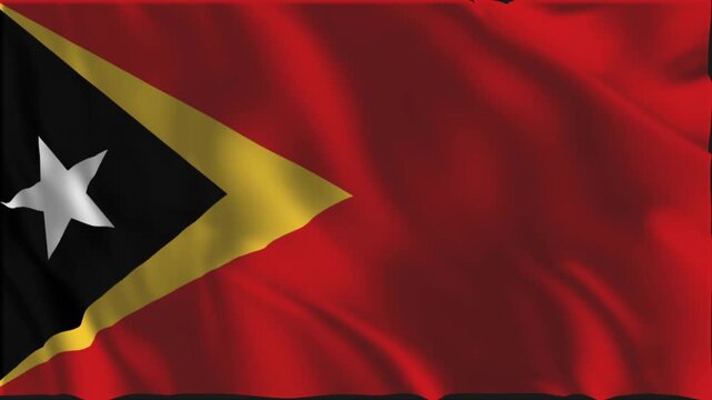 Flag of East Timor waving slowly in the foreground.