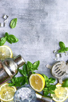 Ingredients fo making cold summer lemon and basil cocktail. Top view with copy space.