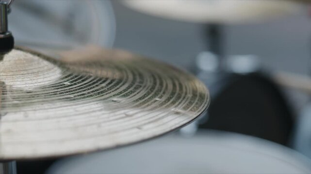 Close up of a vibrating cymbal on a drum set during a live music performance