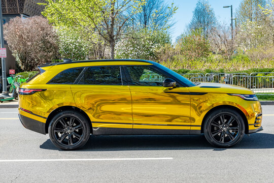 Gold Wrapped Range Rover Velar Parked On City Street In Washington