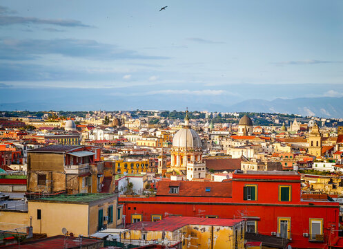 Aerial drone view of Naples old town panorama, scenic cityscape of historic center and iconic volcano view in Italy