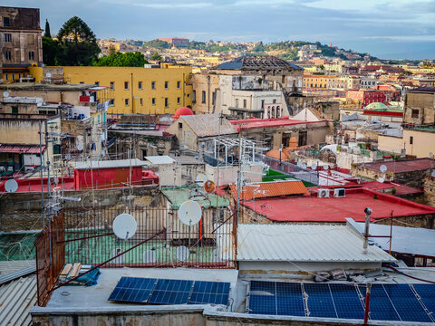 Aerial drone view of Naples old town panorama and roofs of Naples residential buildings, scenic cityscape of historic center and iconic volcano view in Italy