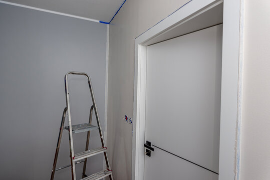 Painting room interior during home renovation project