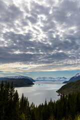 Obraz premium View over the Burfjord with the snow-covered peaks of the Lyngen Alps in the background in northern norway, troms county