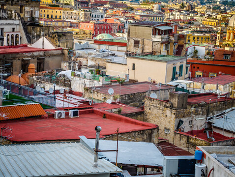 Aerial drone view of Naples old town panorama and roofs of Naples residential buildings, scenic cityscape of historic center and iconic volcano view in Italy