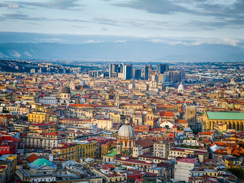Aerial drone view of Naples old town panorama, scenic cityscape of historic center and iconic volcano view in Italy