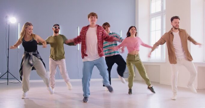 Dance training performance and choreography friends class, fitness studio students, energetic dancing active group learning contemporary movement together tuition, modern sporty dance style, gym room