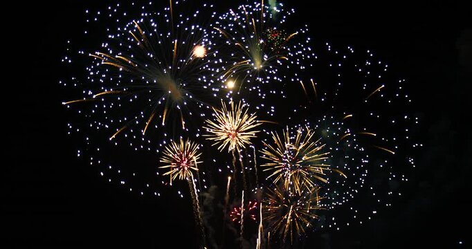 Celebration greeting Beautiful fireworks colorful fireworks on the beach for abstract background , anniversary, celebration , 4th independence day and new year background or wallpaper.