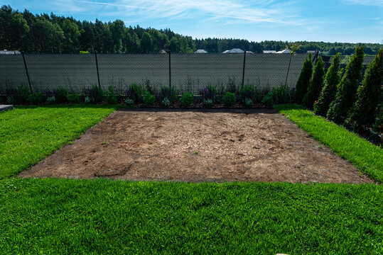 Burnt grass patch in backyard from swimming pool