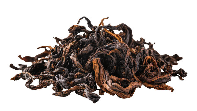 Isolated pile of dry, dark, twisted oolong tea leaves ready for a warm aromatic brew