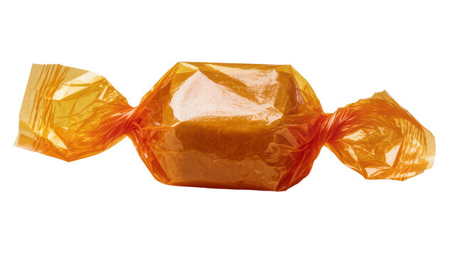 Isolated delicious orange candy wrapped in shiny cellophane, a classic sweet caramel treat