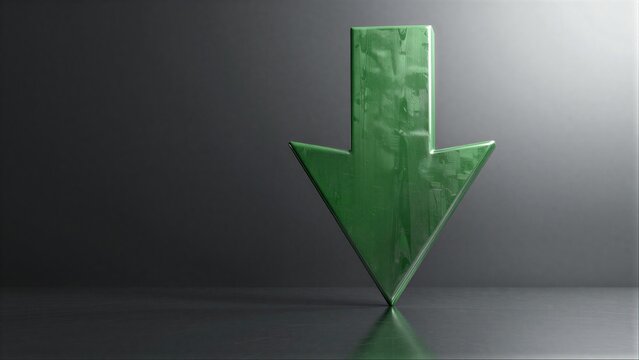 Green arrow points down on dark surface, symbolizing decline or downward trend.