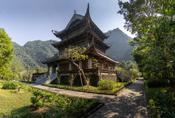Fototapeta premium A scenic view of Temple of Cao Son The Great King, Trang An, Ninh Binh, Vietnam, a popular destination for tourists and pilgrims to come and worship.