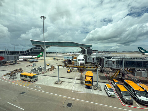 Cathay pacific catering truck preparing airplane for flight