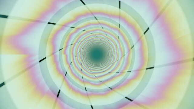Colors swirl and blend in a rotating tunnel shape. The patterns change as the tunnel extends into the distance. Light creates a vibrant atmosphere