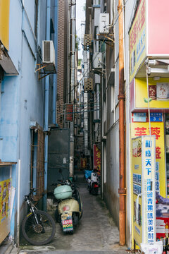 Narrow alley showing urban decay and traditional chinese architecture