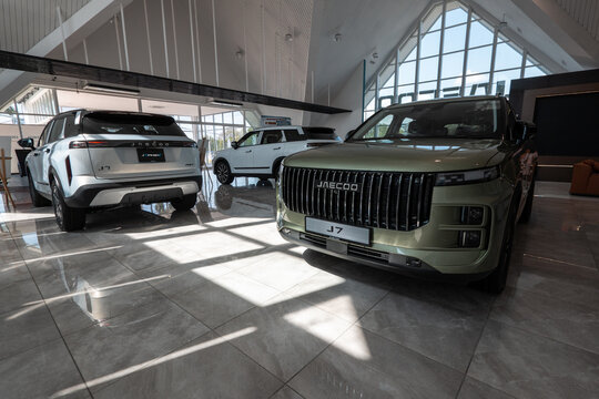Jaecoo j7 suv cars displayed in modern dealership showroom