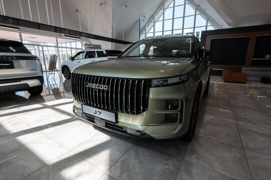 Jaecoo j7 suv cars displayed in modern dealership showroom