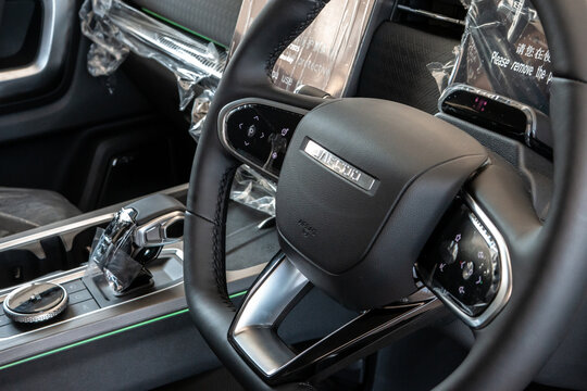 Car interior showing new steering wheel and dashboard technology