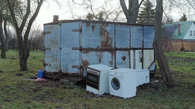 Old container and abandoned devices highlight consumer waste trends.