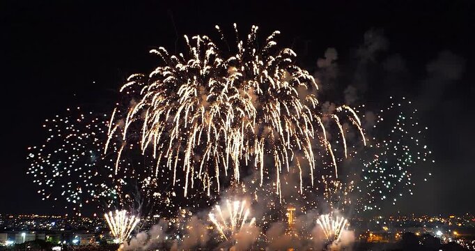 Firework night celebration festival sky light city smoke explosion spark, bright firework display night sky above city skyline, colorful explosive bursts with drifting smoke clouds over urban