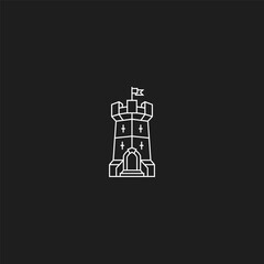 Obraz premium Single medieval fortress tower with flag and crosses.