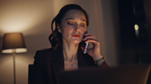Leader person calling cellphone dark cabinet closeup. Nervous businesswoman call