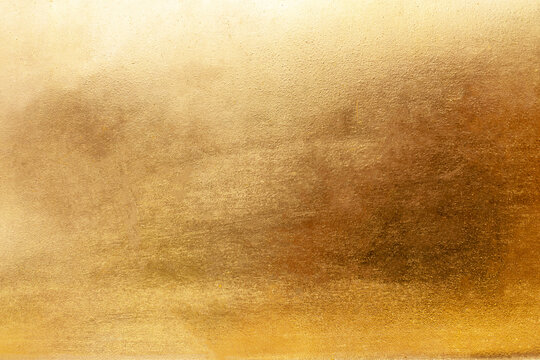 Gold metal background or texture  and gradients shadow horizontal shape, copy space (High resolution), real photo