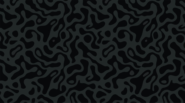 A dark room with a leopard pattern on the wall.